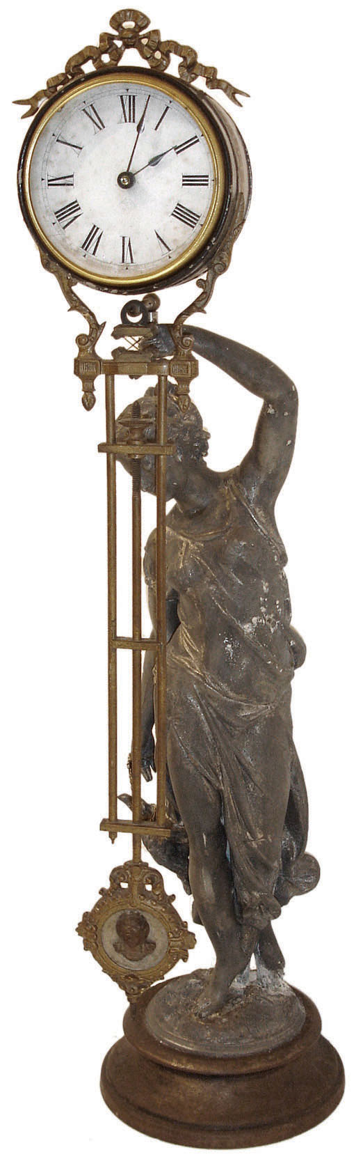 Ansonia Clock Co., New York, "Huntress Swing", the patinated spelter figure of a young woman carrying game birds and holding the clock aloft in her left hand, mounted to a cast iron base, 8 day time only, movement mounted inside a cylinder with cast ribbon ornament, the lower section in gridiron style with cameo style "pendulum" at the bottom, c1900 — Antique Clocks Price Guide