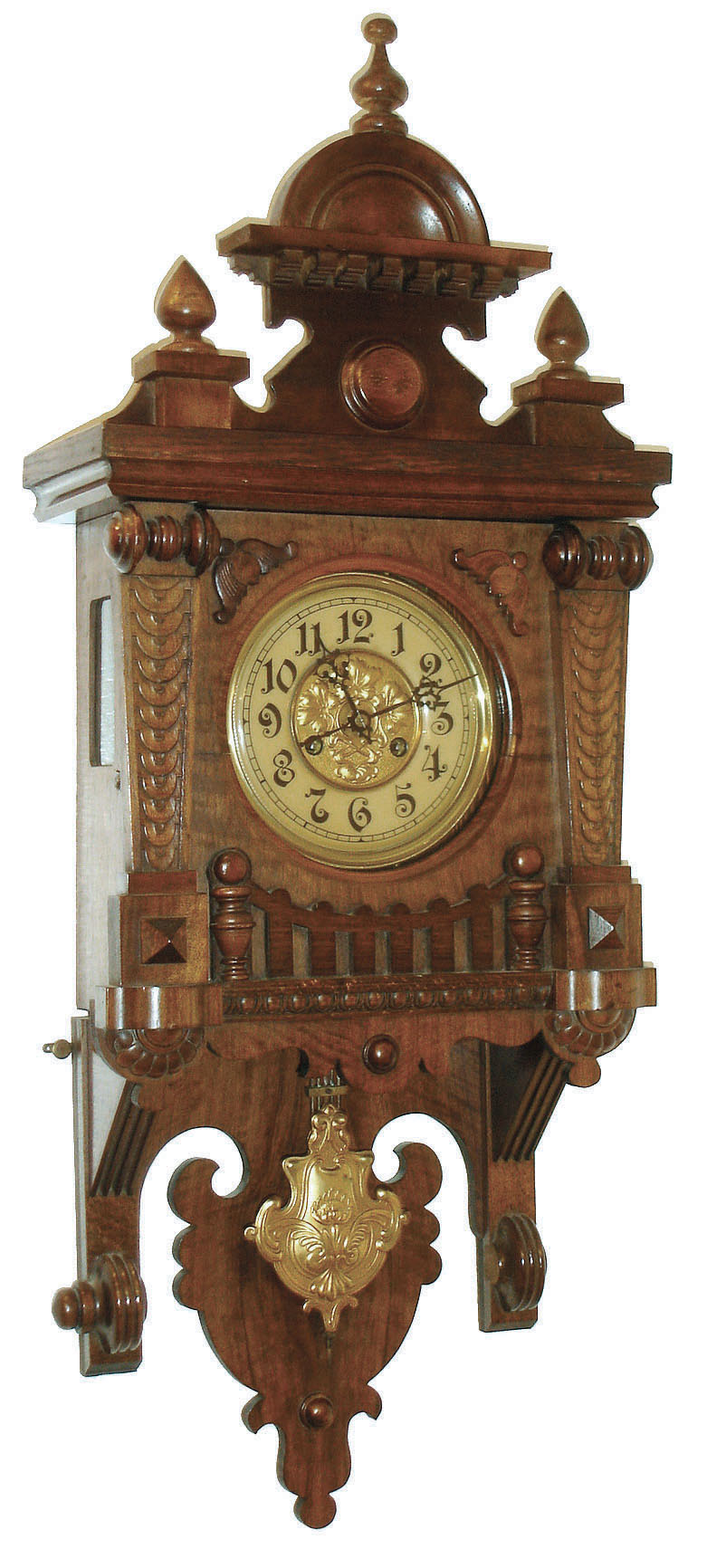 Junghans, Germany, Berlin style Free Swinger, in walnut case with 8 days,single rod striking movement and brass Art Noveau style embossed pendulum, c1910 — Antique Clocks Price Guide