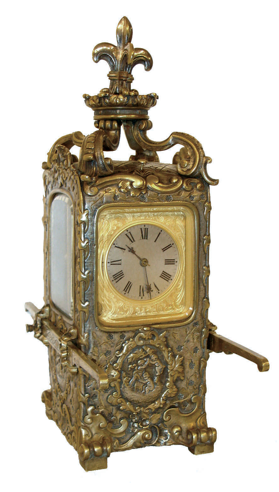 Desk or table clock, French 8 days, time and strike, movement with hour repeating, Roman numeral silvered dial with engraved, gilt mask, blued steel fleur de lis hands, the case with lis glasses and in the form of a sedan chair, the cast case decorated with faux repousse ornament in the rococo style and with fleur de lis finial, and with removable carrying handles, c1890 — Antique Clocks Price Guide