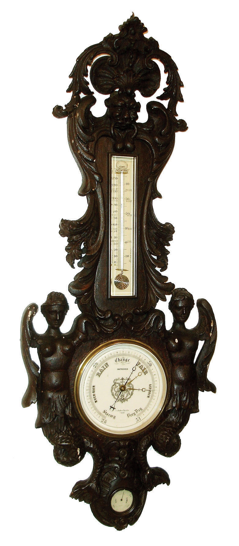 English, large ornate wheel barometer (mercury tube), thermometer and hygrometer, in a carved wooden case flanked by mermaids, with gesso coating and dark finish, c1875 — Antique Clocks Price Guide