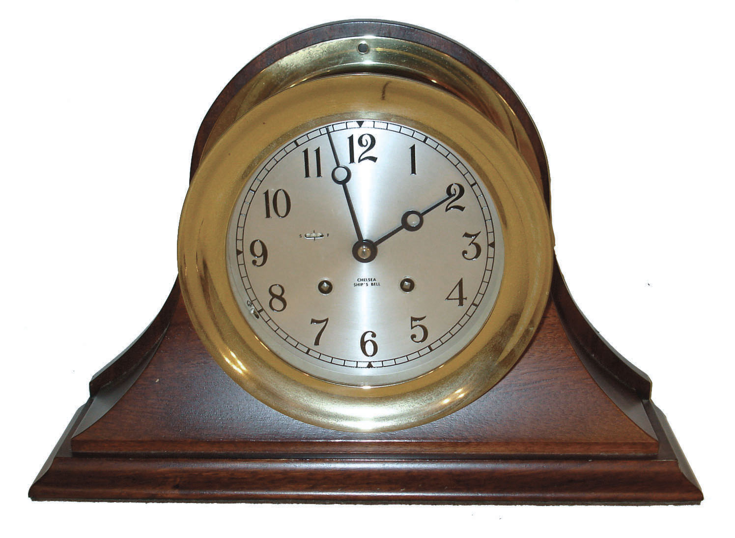 Chelsea Clock Co., Chelsea, Mass. 6" ships bell clock in a cast brass case, Arabic numeral silvered dial moon style hands, and with mahogany base, c1980 — Antique Clocks Price Guide