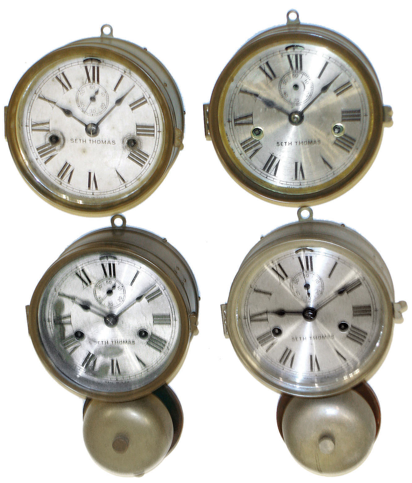 Clocks- 4 (Four) Seth Thomas Marine wall with hinged bezels: two outside bell 2 day ship's strike clocks, one nickel and one brass; two 8 day twin-spring timepieces in brass cases; early 20th century — Antique Clocks Price Guide