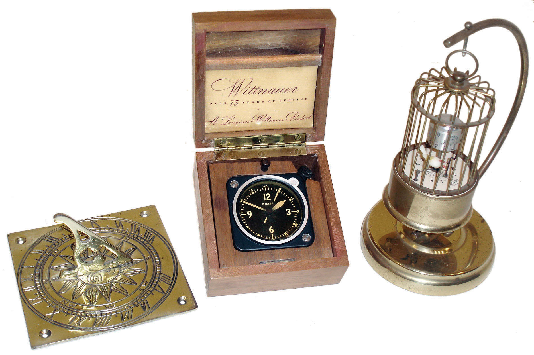 Clocks- 2 (Two) and a sundial: Longines Wittnauer boxed 8 day aircraft clock; Renco/J.Kaiser 30 hour German birdcage novelty alarm clock; plus a modern brass English sundial. 20th century — Antique Clocks Price Guide