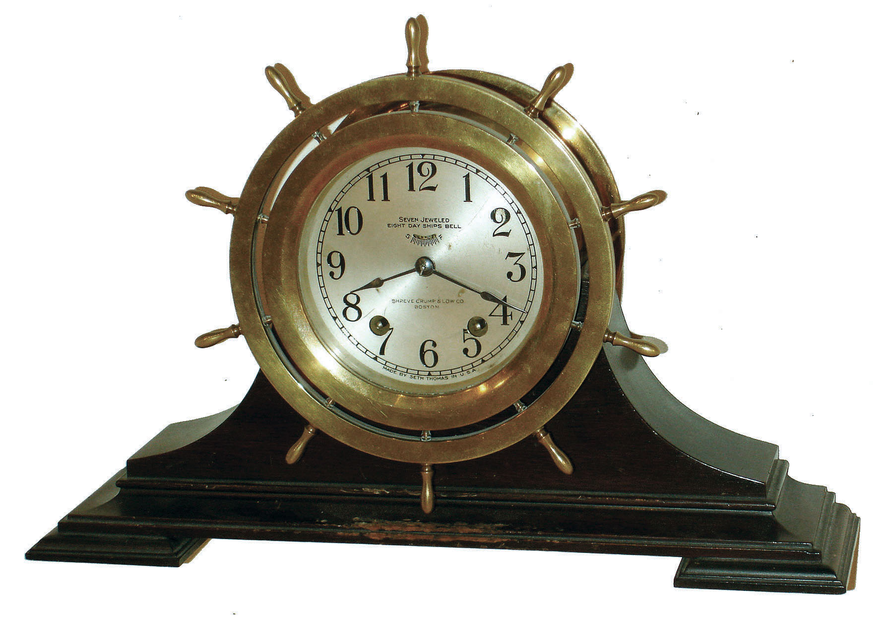 Seth Thomas Clock Co., Thomaston, Conn., "Ship's Wheel" 8 day brass ship's bells clock in mahogany cradle, c1932 — Antique Clocks Price Guide