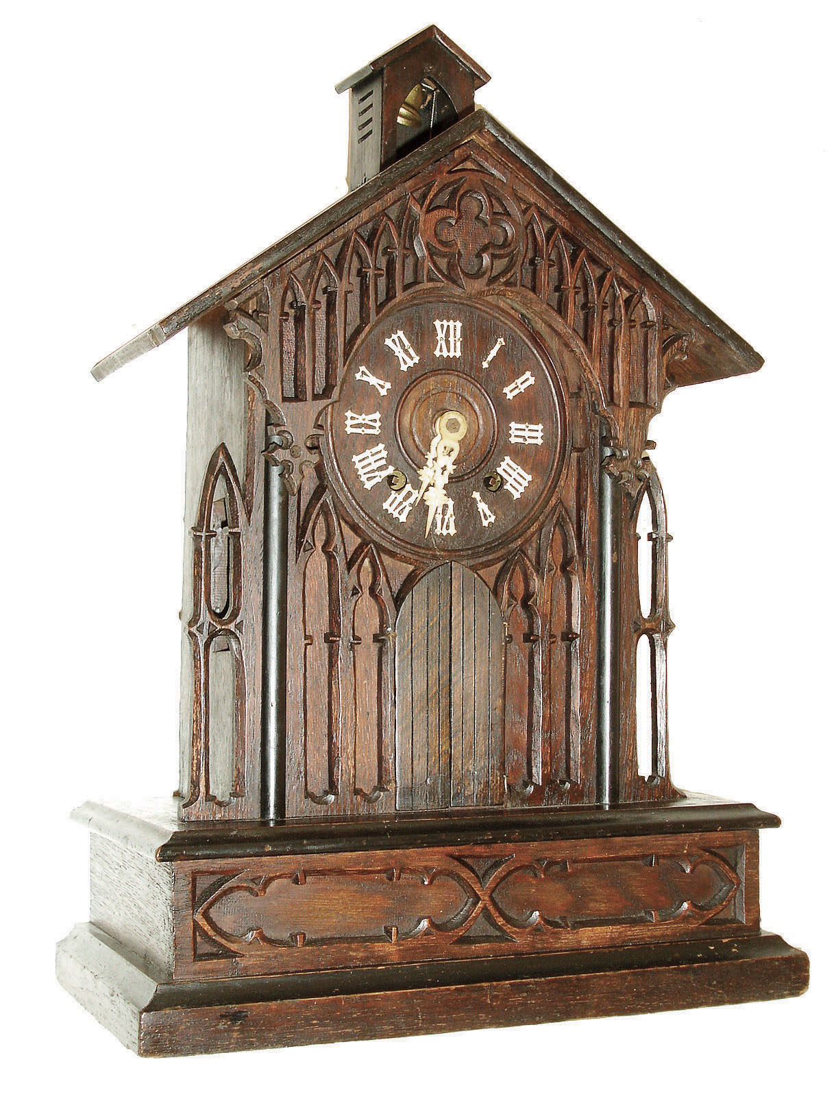 Germany, black forest clock with bell ringer, oak and oak veneer cathedral form case with ebonized moldings and pierced Gothic style ornament, the doors below the dial opening at the hour and half hour, revealing a monk who pulls a rope and appears to ring the bell at the top of the building as the clock strikes, Roman numeral dial with carved bone hands, brass 8 days, time and strike, movement, c1880 — Antique Clocks Price Guide