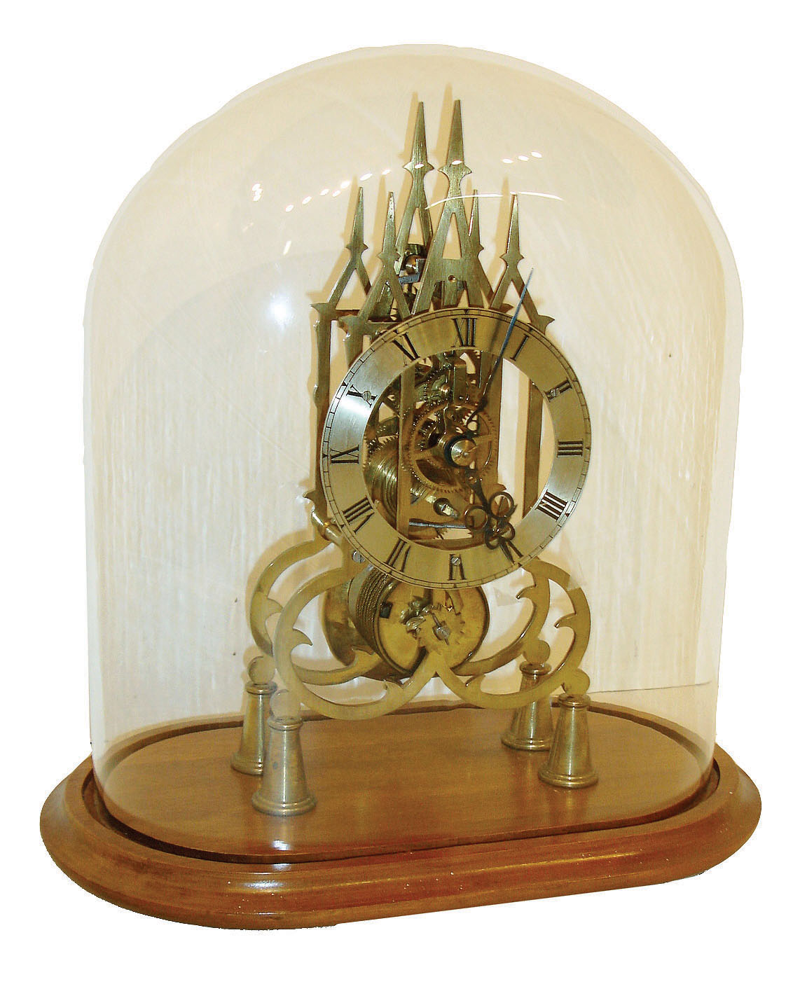 Spain, single fusee timepiece skeleton, in a 3 spire frame of Gothic influence, and with a solid ring silvered brass dial, mounted to a well made walnut base and with a glass dome, c,1975 — Antique Clocks Price Guide
