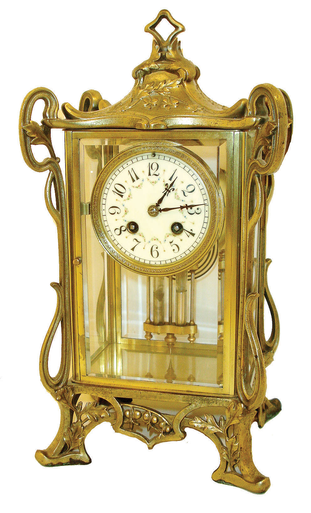 France, 8 days, time and strike, crystal regulator with pendule a Paris movement and gilt mercury pendulum. Art nouveau inspired openwork spelter / white metal frame with bright gold-tone finish, on tall feet and with pagoda like top, containing the polished brass case with beveled glasses, Arabic numeral white enamel dial, gilt hands, c1900 — Antique Clocks Price Guide