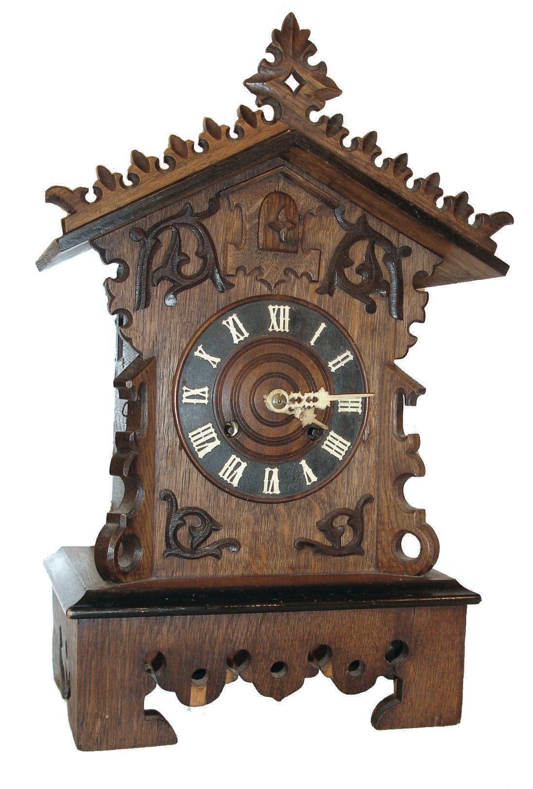 Germany, Black Forest shelf cuckoo, oak and oak veneered case with ebonized moldings, leaf carved roof trim, and applied carved ornament on case front, Roman numeral wooden dial with carved bone hands, brass 8 days, time and strike, movement, the time train with going barrel, and the strike train with fusee, carved, painted wooden bird, c1880 — Antique Clocks Price Guide