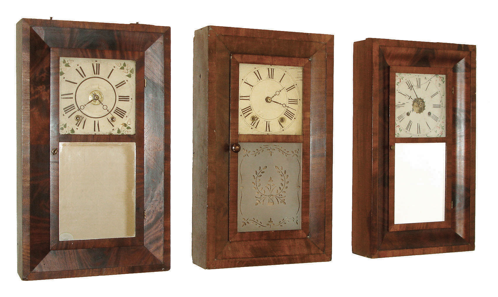Clocks- 3 (Three) early American 30 hour clocks. (1) Chauncey Jerome, Bristol, CT time and strike, weight driven OG in mahogany veneer case, c1845.  (2) Henry C. Smith, Plymouth, Conn., time and strike, weight driven wood movement OG in mahogany veneered case, c1840. (3) Daniel Pratt, Reading, Mass, time, strike & alarm weight driven wood movement in bevel mahogany veneer case c1840. — Antique Clocks Price Guide