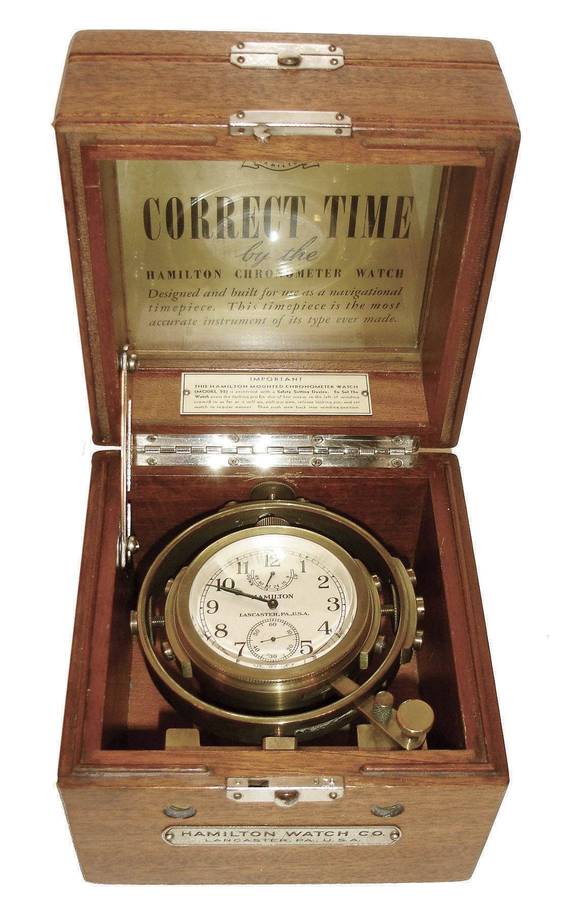 Hamilton Watch Co., Lancaster, Penn., model 22 chronometer with wind indicator, 35 size, 21 jewels, stem wind, pin/stem set, adjusted to 6 positions and temperature, straight line damascened nickel plate movement, with lever escapement and micrometric regulator, movement marked "U.S. Navy Bu. Ships - 1943", Arabic numeral metal dial and black steel, spade and poker hands, in a gimbaled bowl, contained in a mahogany box with name plate on front, serial #2F26390, c1943, with outer protective box, "Care and Handling of the Hamilton Marine Chronometer" booklet, and "Correct Time" display card inside lid. — Antique Clocks Price Guide