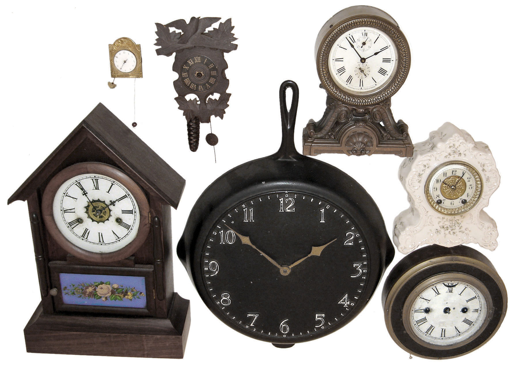 Clocks- 7 (Seven): six mechanical wall and mantel clocks, plus a 16" diameter metal frying pan clock with battery movement, early 20th century — Antique Clocks Price Guide