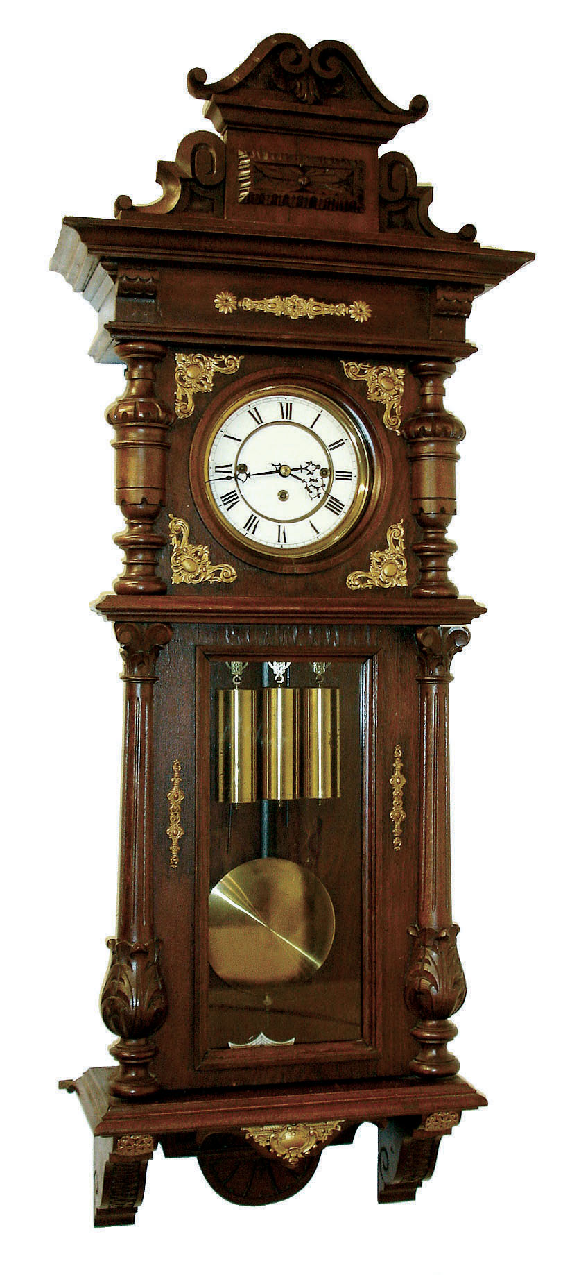 Germany, Vienna regulator, stained hardwood and walnut veneer case, architectural case with divided door, applied, carved split columns, removable carved crest, and applied stamped brass ornament, Roman numeral white enamel dial , pierced steel hands, brass 3 train, weight driven, 8 days, time and strike, movement, with grand sonnerie striking, brass pendulum with ebonized wooden rod, and 3 brass weights, c1910 — Antique Clocks Price Guide