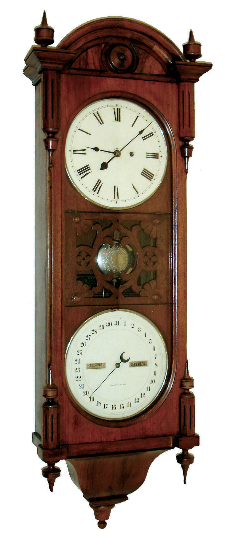 Seth Thomas Clock Co., Thomaston, Conn., "Office Calendar No. 10" earlier model wall clock, 8 days, time and perpetual calendar, weight driven movement in a black walnut case with burled and ebonized accents and two painted metal dials, dated 1887 — Antique Clocks Price Guide