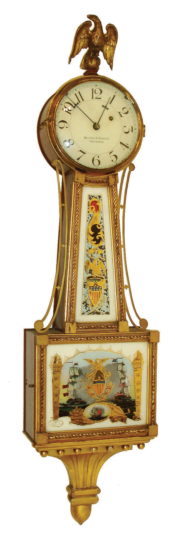 Walter Durfee, Providence, Rhode Island, patent timepiece or banjo clock, mahogany case with gilt frames and presentation bracket, lower tablet with battleships, throat glass with gilt eagle and stars and bars shield, case top with gilt composition eagle, signed Arabic numeral white painted dial, steel barbed hands, 8 days, E. Howard & Co. timepiece movement with damascened pendulum, cast iron weight, c1910 — Antique Clocks Price Guide