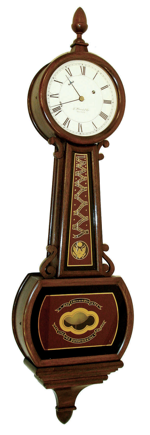 E. Howard & Co., Boston, Mass., "Bicentennial Banjo", wall clock, 8 days, time only, weight driven movement in a mahogany case with reverse painted throat and lower tablets with 13 colonies motif and painted metal dial. 1976 — Antique Clocks Price Guide