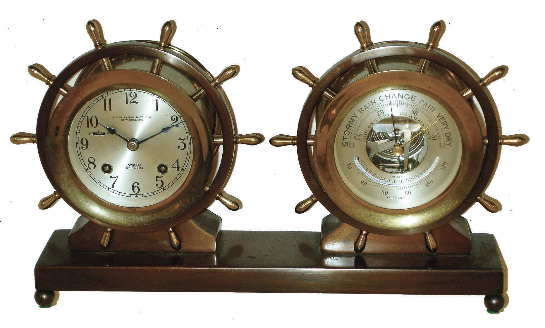 Chelsea Clock Co., Boston, for Baker, Lyman & Co., Inc., New Orleans, "Claremont" bronze and brass 8 day ship's bell striking clock and barometer/thermometer set with yacht wheel handles, #717516, c1967. — Antique Clocks Price Guide