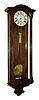 C. Suchy & Soehne, in Prague, Vienna regulator, walnut and walnut veneered case with with light wood trim around side glasses, and with string inlay in backboard, signed Roman numeral white enamel dial, pierced blued steel hands, signed brass 30 day timepiece movement, polished brass pendulum and weight, c1855