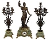 France, large and impressive 3 piece figural mantel garniture, the clock case of green onyx on gilt leaf and scroll ornamented paw feet, gilt dial surround in the rococo style, surmounted by a patinated spelter female figure representing Abundance, the front of the sculpture with applied plaque reading "Abondance par Guillemin", the sculpture also signed "L. Guillemin", gilt bezel with beveled glass, Arabic numeral white enamel dial with illegible signature, blued steel hands, 8 days, time and strike, pendule a Paris movement marked Vincenti, the companion candelabras with patinated surfaces and rocaille ornament, resting on green onyx bases and also with gilt paw feet, c1890