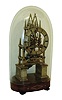 English made single chain fusee skeleton timepiece in a sharp Gothic frame with 6 heavily turned baluster pillars, and a solid silvered chapter ring and pierced lancet hands, c1840. Silvered engraved brass cross piece indicating it was retailed by Griffiths of London.