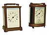 Clocks- 2 (Two): French carriage clocks, the first with typical brass case and beveled glass panels, Roman numeral white enamel dial, Breguet style hands, 8 day timepiece movement with cylinder platform, the other with oval brass case and turned brass feet, beveled glass panels, Arabic numeral white enamel dial, 8 day time and alarm movement with lever platform, both early 20th century