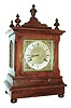 New Haven Clock Co., New Haven, Conn., "Chime No. 4" spring driven 8 days, time and strike, (hour and quarter strike on 5 cathedral gongs) in a solid mahogany case with an etched silver dial. The quarter strike is provided by a separate movement, c1911.