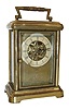 Waterbury Clock Co., Waterbury, Conn.. 8 day time only, carriage clock, employing a skeletonized six spoke long wind movement with the addition of a large barrel to increase duration, lacquered polished brass case, Roman numeral paper dial, dial mask with Waterbury logo and Pat. May 21, 1878, c1880