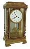 France, extra large "crystal regulator", the dial surrounded by a fancy cast and gilt bezel, the pendulum of sun-burst motif, and the case corners with full Corinthian reeded columns, and all sides with heavy beveled glass, the 5.6" porcelain dial with Arabic numerals and finely pierced hands, c1850