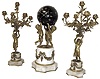 France, 3-piece mantel set, "3-Cherubs" supporting a star studded ball containing the movement, time indicated by "arrow" hands, all 3 with bases of white marble, and ormolu swag accents, and each candle stand with rose cups for 5 candles, and with cylinder platform, bell strike movement intact, C.1880