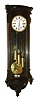 Simon Frankl, in Wien, Austria, Vienna regulator, case with rosewood graining, door with scrolled corbels, bowed, fluted top with conforming cavetto cornice, bottom with curved moldings and applied carved drop, signed Roman numeral white enamel dial, pierced blued steel hands, brass 8 day 3 train grand sonnerie striking movement, polished brass pendulum and weights, c1860