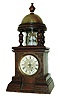German, small 30 hour novelty timepiece, in the form of a lighthouse, wound through rear hinged door, and with a long balance staff bearing faceted glass "jewels", rotating back and forth behind a cylindrical lighthouse lens, c1900