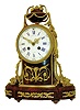Raingo Fres., a Paris, mantel clock, griotte marble case with gilt bronze mounts, the oblong base with inset panels containing gilt foliate ornament, case front with Adamesque vines and torch, the top with urn and laurel swags, and sides with gilt cornucopia spilling their bounty onto the base, all resting on toupie feet, Roman numeral white enamel dial with Arabic outer 5 minute markers, signed "Raingo. Fres. a Paris", gilt Louis XV style hands, 8 days, time and strike, pendule a Paris movement, marked Raingo a Paris, c1870