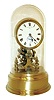 Eureka Clock Co., Ltd., London, England, long running battery clock, the movement with large exposed balance oscillating below the Roman numeral white enamel dial, blued steel hands, all resting on a polished hollow brass base, and covered with a glass dome, serial #9532, c1910