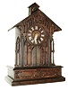 Germany, black forest clock with bell ringer, oak and oak veneer cathedral form case with ebonized moldings and pierced Gothic style ornament, the doors below the dial opening at the hour and half hour, revealing a monk who pulls a rope and appears to ring the bell at the top of the building as the clock strikes, Roman numeral dial with carved bone hands, brass 8 days, time and strike, movement, c1880
