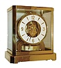 Jaeger - LeCoultre, Switzerland, "Atmos" clock, 15 jewel gilt caliber 528 movement, gilt torsion pendulum, round white painted dial with applied gilt Arabic numerals and arrow markers, gilt hands with black painted tips, all contained in a glazed rectangular case with removable front panel, serial #328795