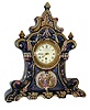 Chelsea, and E.F. Caldwell & Co., New York, majolica style clock case with cobalt blue ground, and multicolor ornament, with enamel painting of cupid in his chariot and three female figures, gilt bezel with convex glass, Roman numeral white enamel dial, pierced gilt hands, and Chelsea 8 days, time only, movement with watch escapement, serial #171669, c1925