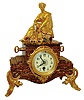 France, 8 days, time only, red and gray marble mantel timepiece with a seated muse and gilt accents with creamy porcelain dial, c1900