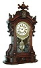 Ansonia Clock Co., New York, "Monarch" 8 day time, hour/half hour strike movement shelf clock in walnut case. c.1880.