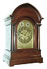 Germany, chiming mantel clock, mahogany case with turned columns, stepped, molded base, and molded, lancet arch cornice, engraved brass dial with Arabic numeral silvered chapter ring, chime/ silent indicator and regulator, blued steel hands, brass 8 day quarter chiming movement, playing Westminster on rods, and marked "Made in Wurttemberg", c1900