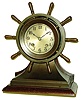 Chelsea Clock Co., Boston, "Mariner" 8 day 3 3/4"-dial time and ship's bells Yacht Wheel bronze marine clock on mahogany stand, #194435, 1929