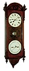 Seth Thomas Clock Co., Thomaston, Conn., "Office Calendar No. 10" earlier model wall clock, 8 days, time and perpetual calendar, weight driven movement in a black walnut case with burled and ebonized accents and two painted metal dials, dated 1887