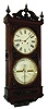 Ithaca Calendar Clock Co., Ithaca, N.Y., "Regulator No. 1" or "Hanging Bank" wall clock, 8 days, time and perpetual calendar, two weight driven movement in a walnut case with composite appliqu s and papered metal dials, c1875
