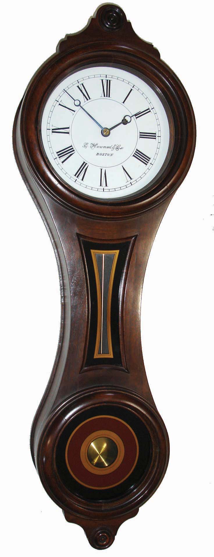 E. Howard & Co., Boston, Mass., ÒRegulator No. 10Ó figure eight reissue wall clock no. 269, 8 days, time only, weight driven movement, walnut case, painted metal dial, reverse painted throat and lower tablets, dated 1976. — Antique Clocks Price Guide