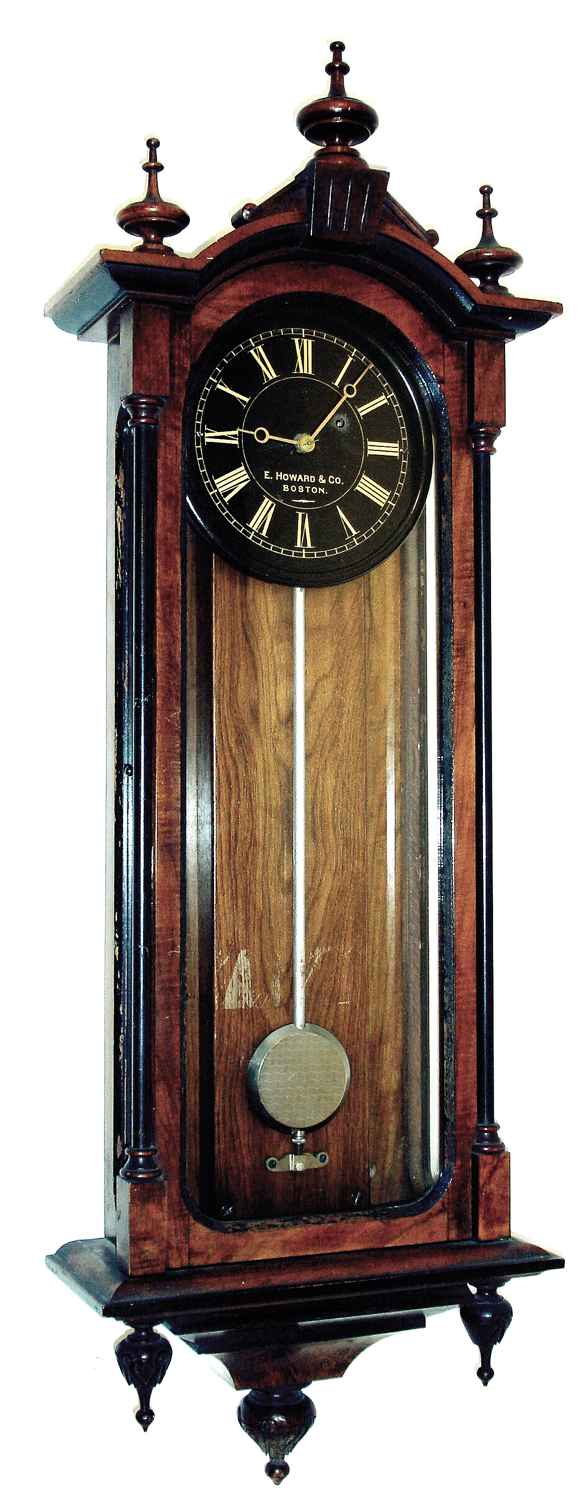 E. Howard & Co., Boston, Mass., ÒNo. 59-8 RegulatorÓ wall clock, 8 days, time only, weight driven movement in a walnut case with burled and ebonized highlights and a black painted iron dial with gold numerals and hands and damascened nickel plated pendulum, c1885 — Antique Clocks Price Guide
