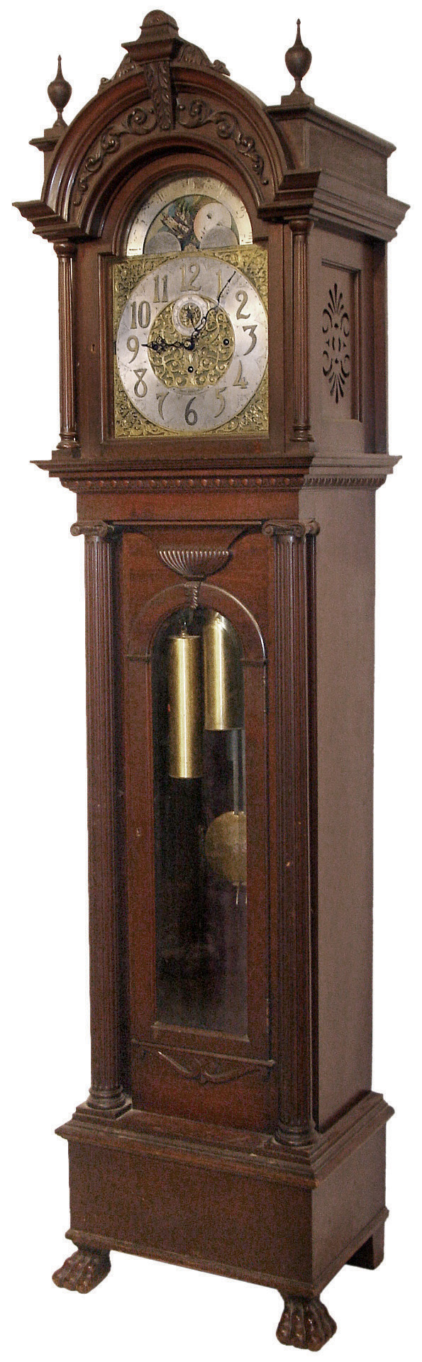 Tobey Furniture Co., Chicago, Illinois, tall case clock, 8 days, time, strike and chime on 5 tubes stamped Elite, three brass, weight driven, German Winterhalder & Hofmeier movement in a mahogany case with full reeded Corinthian columns flanking trunk and hood, applied carvings on hood crest and trunk door, resting on paw feet with a, brass dial with silvered chapter ring, subsidiary seconds, moon phase and cast brass and etched corner spandrels and dial center, c1905 — Antique Clocks Price Guide