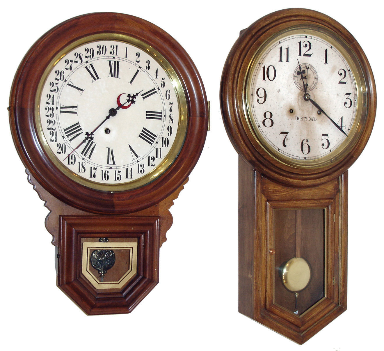 Clocks- 2 (Two): (1) Waterbury Clock Co., Waterbury, Conn., ÓAdmiralÒ wall hanging wood case clock with a, spring driven, double wind 30 day timepiece movement, c1925. (2) The Ingraham Co., Bristol, Conn., ÓDew DropÒ wall hanging clock with a, spring driven, time and calendar movement, c1909. — Antique Clocks Price Guide