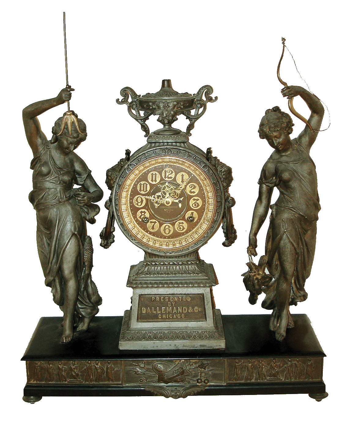 Ansonia Clock Co., New York, NY, ÒFisher and HunterÓ double statue figural shelf clock, 8 days, time and strike, spring driven movement with decorated back plate. SIlver finished spelter case on an enameled cast iron base with applied cast Silver finished friezes with a brass dial, open escapement and embossed numerals, c1894 includes plaque cast into base ÒPRESENTED BY DALLEMAND & CO. CHICAGOÓ — Antique Clocks Price Guide