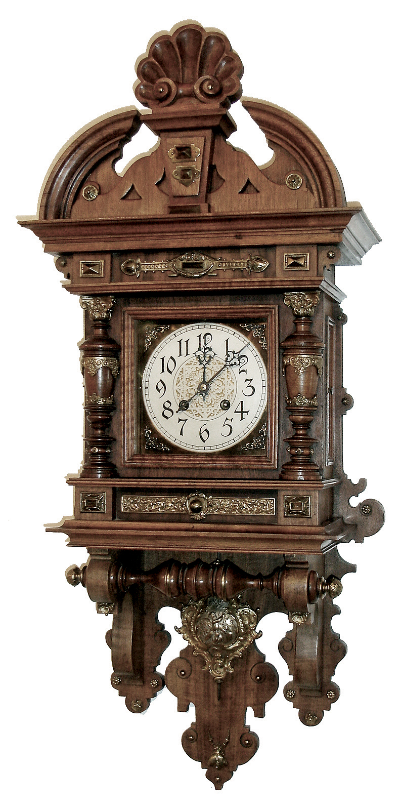 Lenzkirch, Germany, rare Freischwinger in walnut, similar to the model 70, but with different side columns and with cast brass adornments; note the tops of the Corinthian columns are brass as well; this is a desirable quarter striking clock, and with fancy cast ÒcupidÓ pendulum. There are 4 variations on this clock in the sale today. Serial Nr. 1,133,599, c1897 — Antique Clocks Price Guide