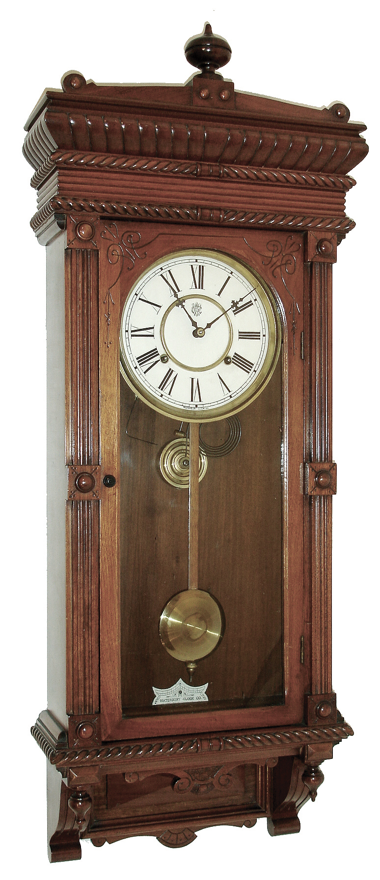 Waterbury Clock Co., Waterbury, Conn., ÓLeedsÒ wall hanging clock in a walnut case with a spring driven, 8 days, time and strike, movement, c1893 — Antique Clocks Price Guide