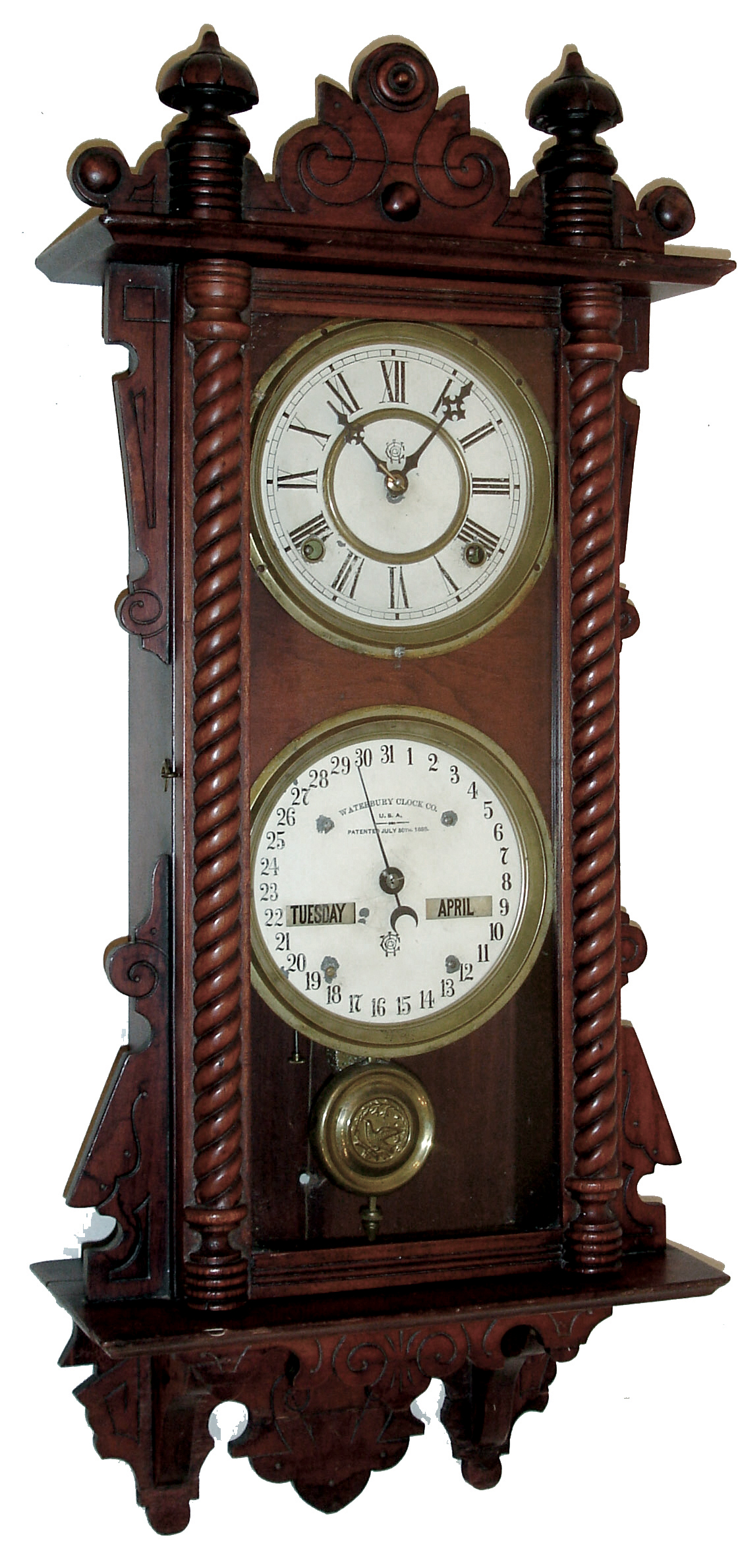 Waterbury Clock Co., Waterbury, Conn., ÓCalendar No. 36Ò wall hanging clock with a spring driven, 8 days, time and half hour strike movement and perpetual calendar mechanism in a cherry case, c1891. — Antique Clocks Price Guide