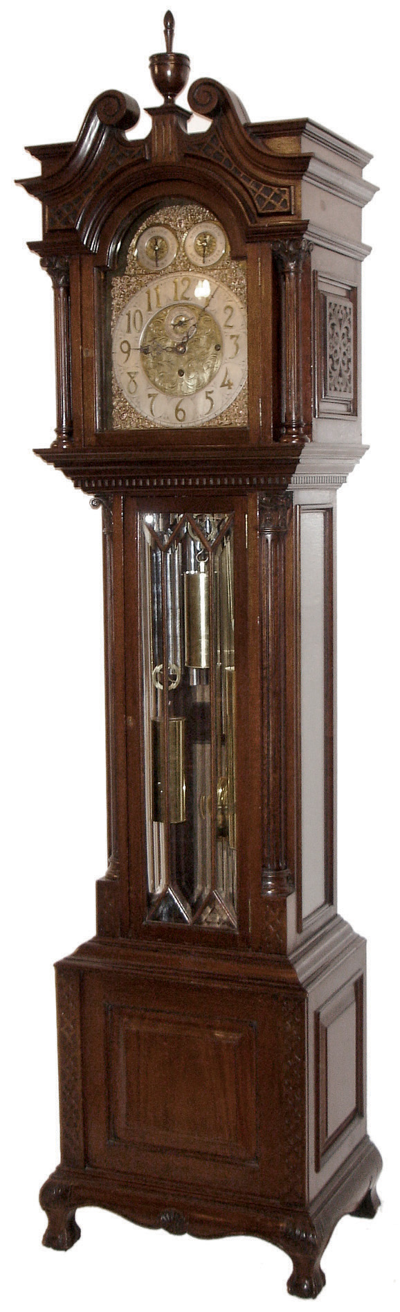 J.J. Elliott, London, England tall case clock, 8 days, time, strike and Westminster & Whittington chime on nine tubes, Triple brass, weight driven movement in a mahogany case with full round fluted Corinthian columns flanking hood, fluted Corinthian corner columns flanking trunk door, pierced carved side frets, dental molding below hood, seven pane beveled glass trunk door and sides on a base with flat carved side columns flanking a raised center panel and hairy ball and claw feet. The brass dial has raised silver chapter ring and two subsidiary dials for Strike / Silent and tune selection, all surrounded by ornately cast brass trim and spandrels with nicely engraved dial center, c1910 — Antique Clocks Price Guide